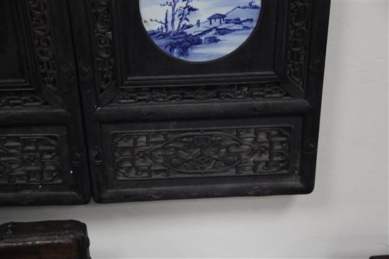 A set of four Chinese blue and white porcelain mounted wood panels, 121.5 x 38cm